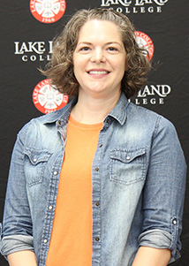 A professional photograph of Sarah Wright.